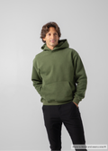 Man wearing a green hoodie against a plain background
