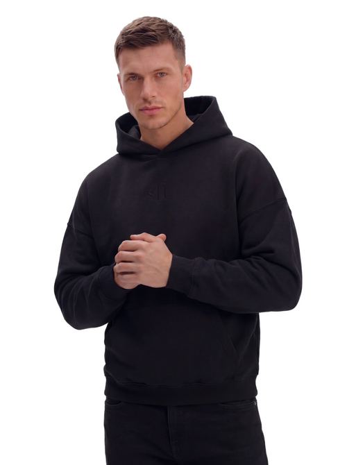 Man wearing a black hoodie on a white background