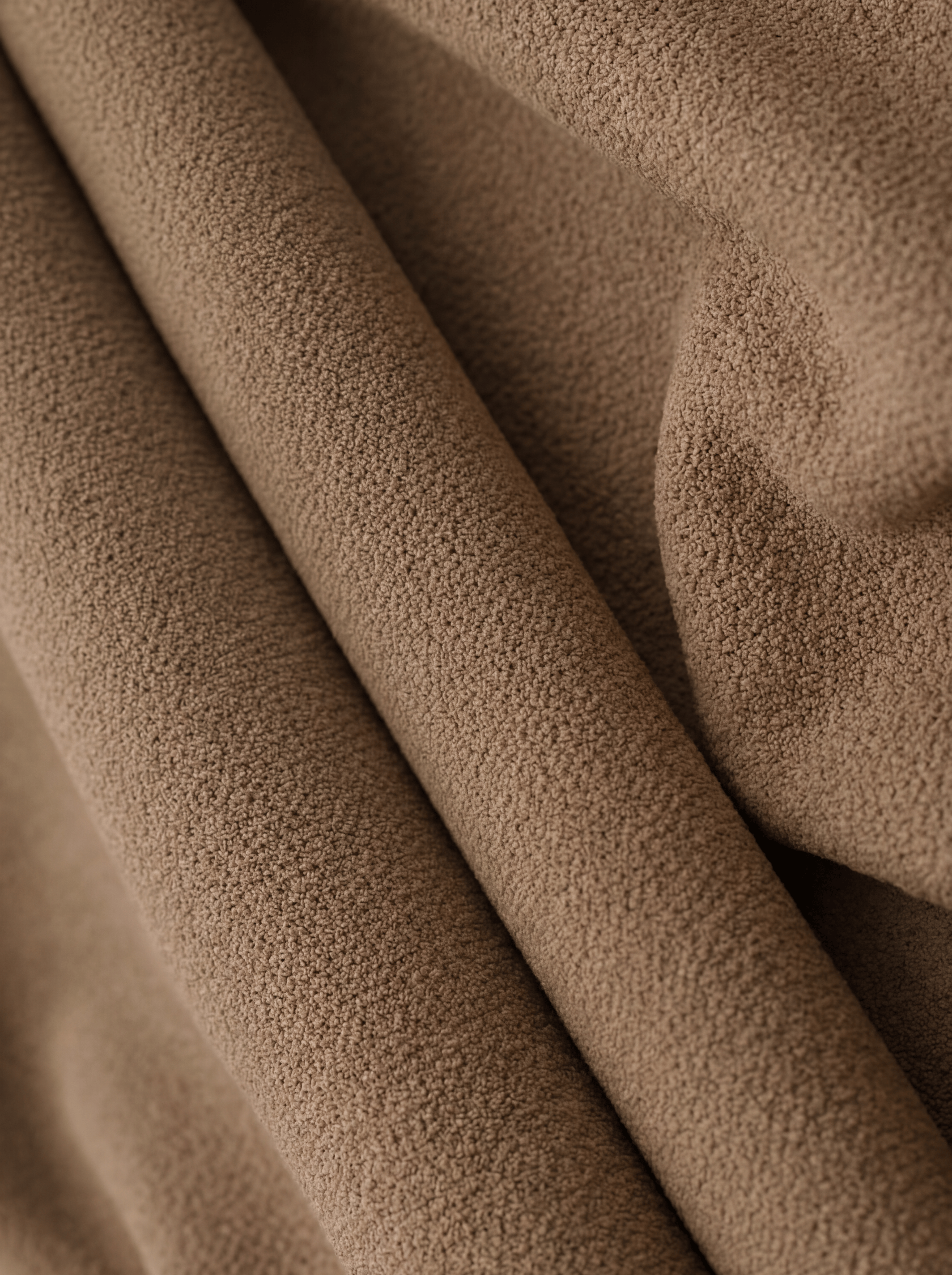 Close-up of brown fabric with a soft texture