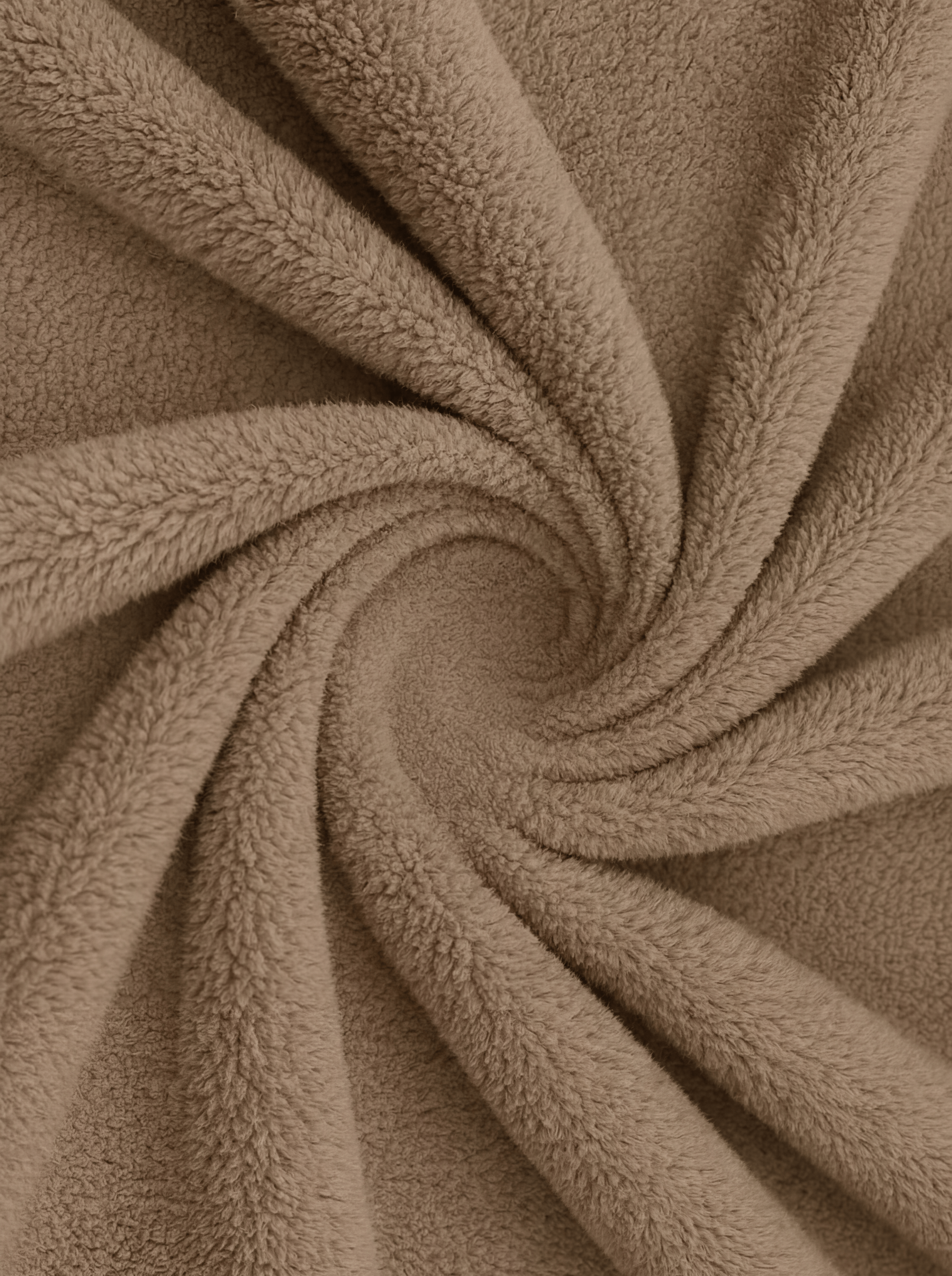 Close-up of brown fleece fabric in a swirl pattern