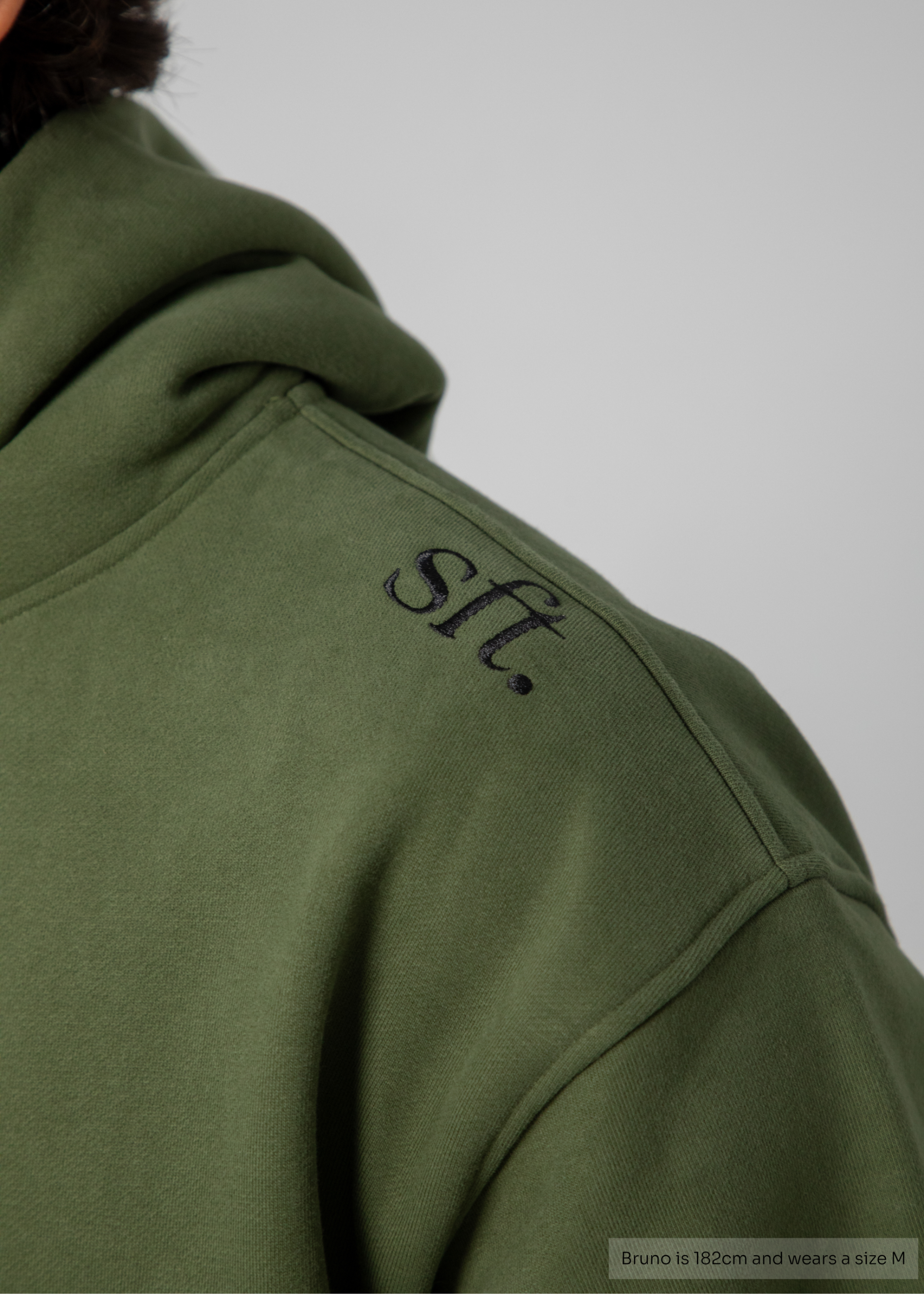 Green hoodie with 'sft' logo on a plain background